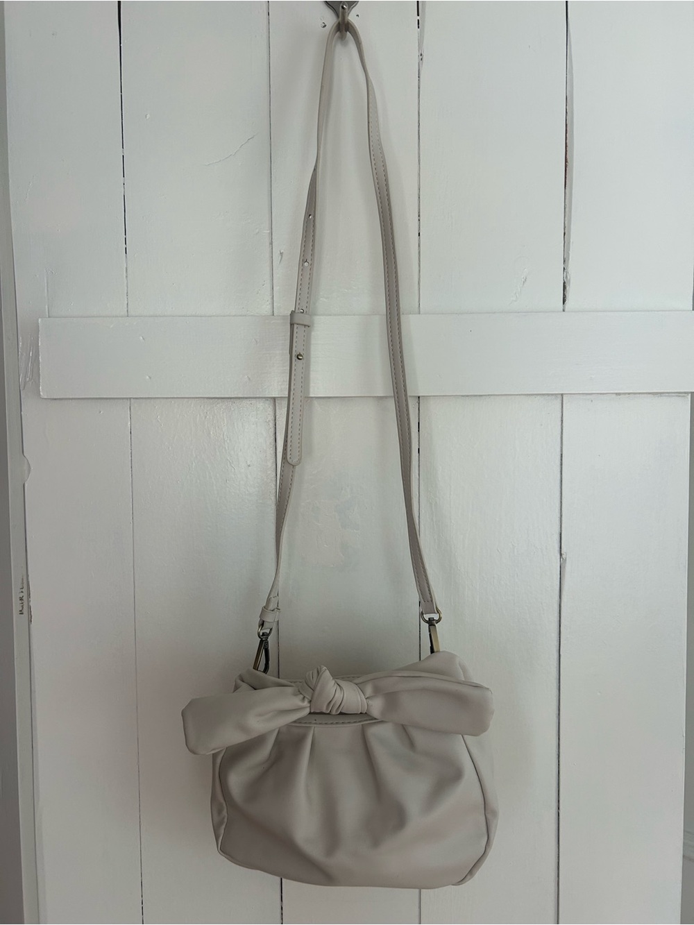 Soft Knot-Top Crossbody Bag in Cream